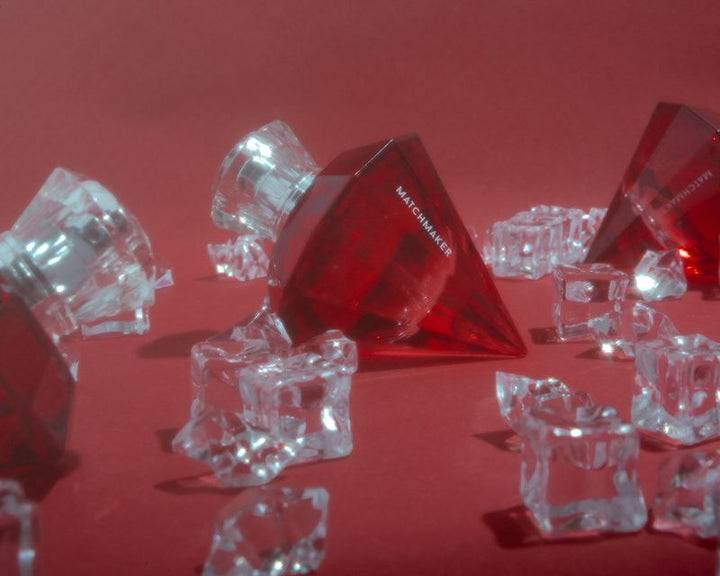 Matchmaker pheromone perfume surrounded by crystal ice cubes